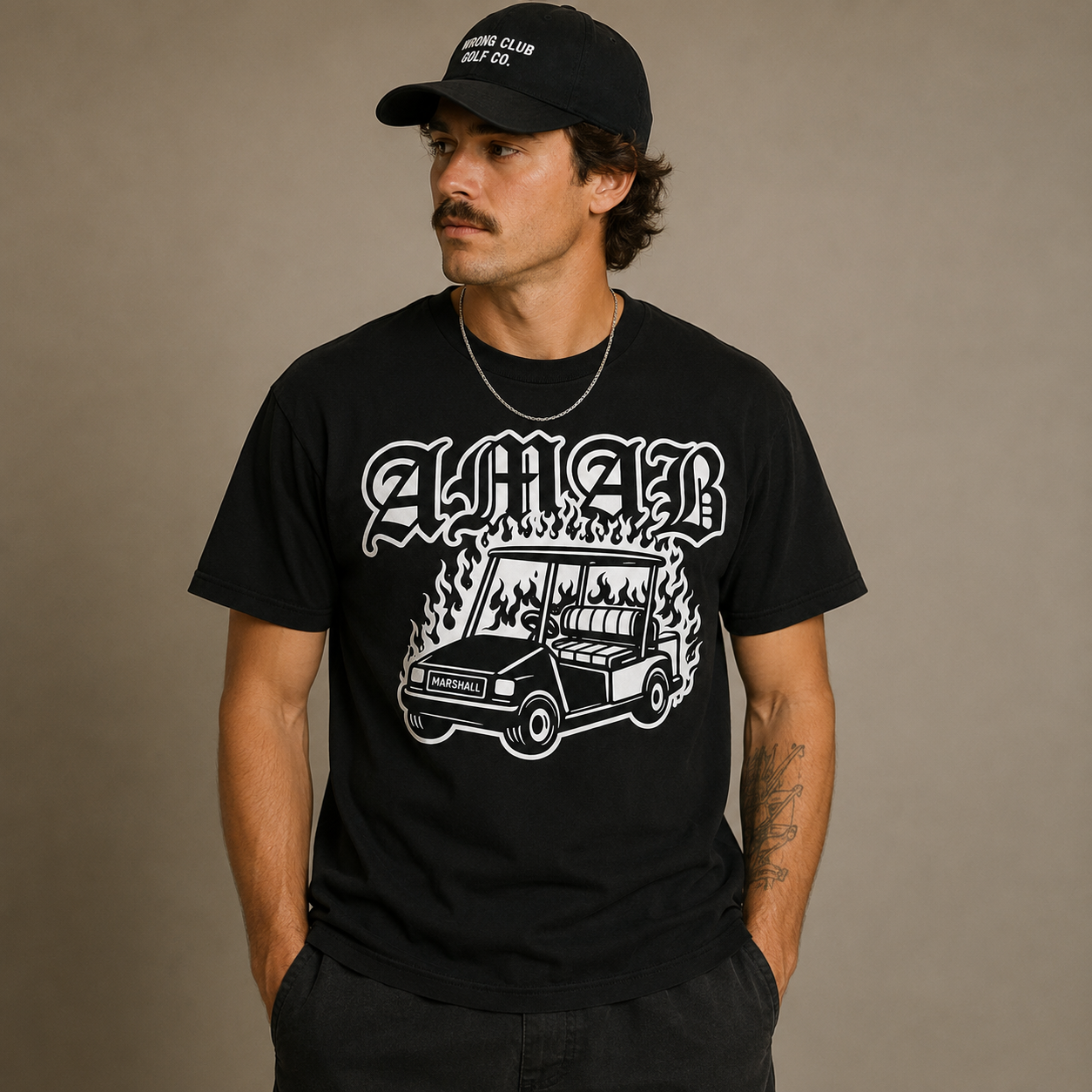 Model wearing the black AMAB Burning Marshal golf cart tee